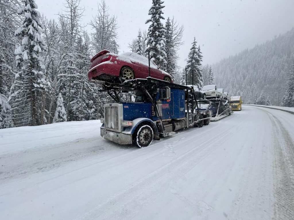 Safe vehicle transport with open-car transport trucks